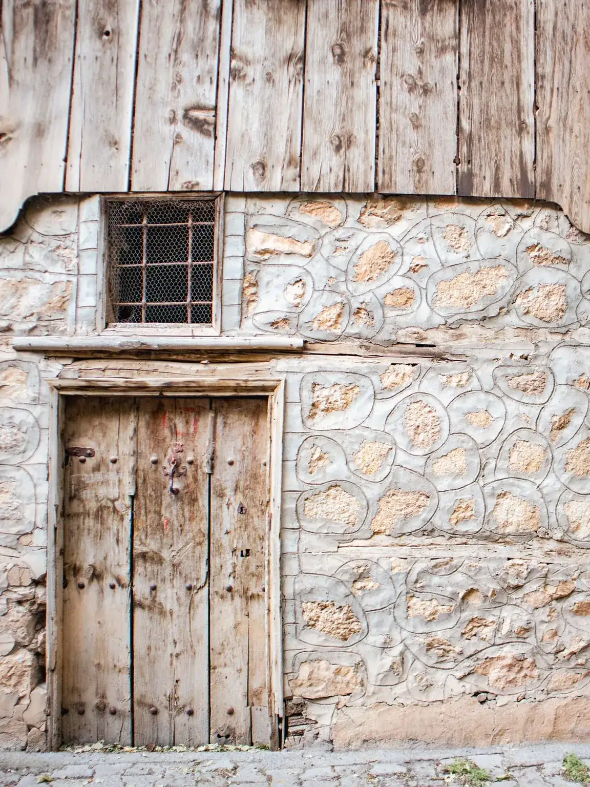 Front door made of vertical boards