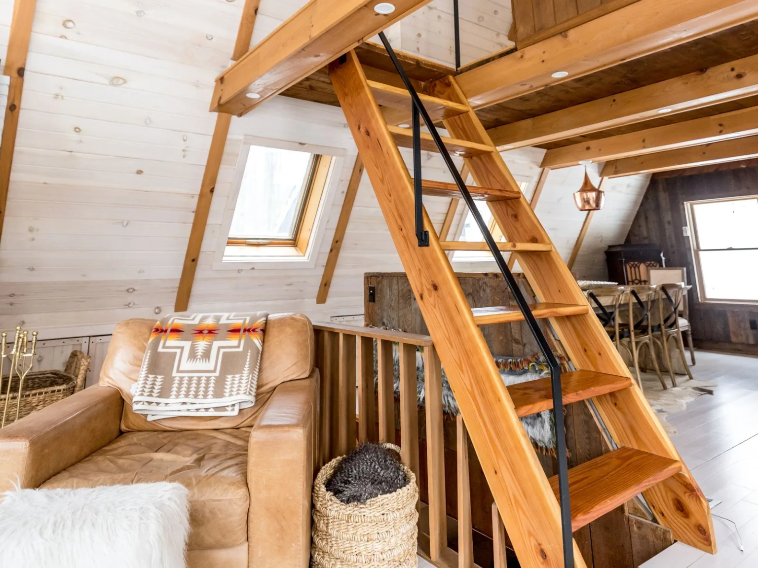Steep wooden staircase up to the attic